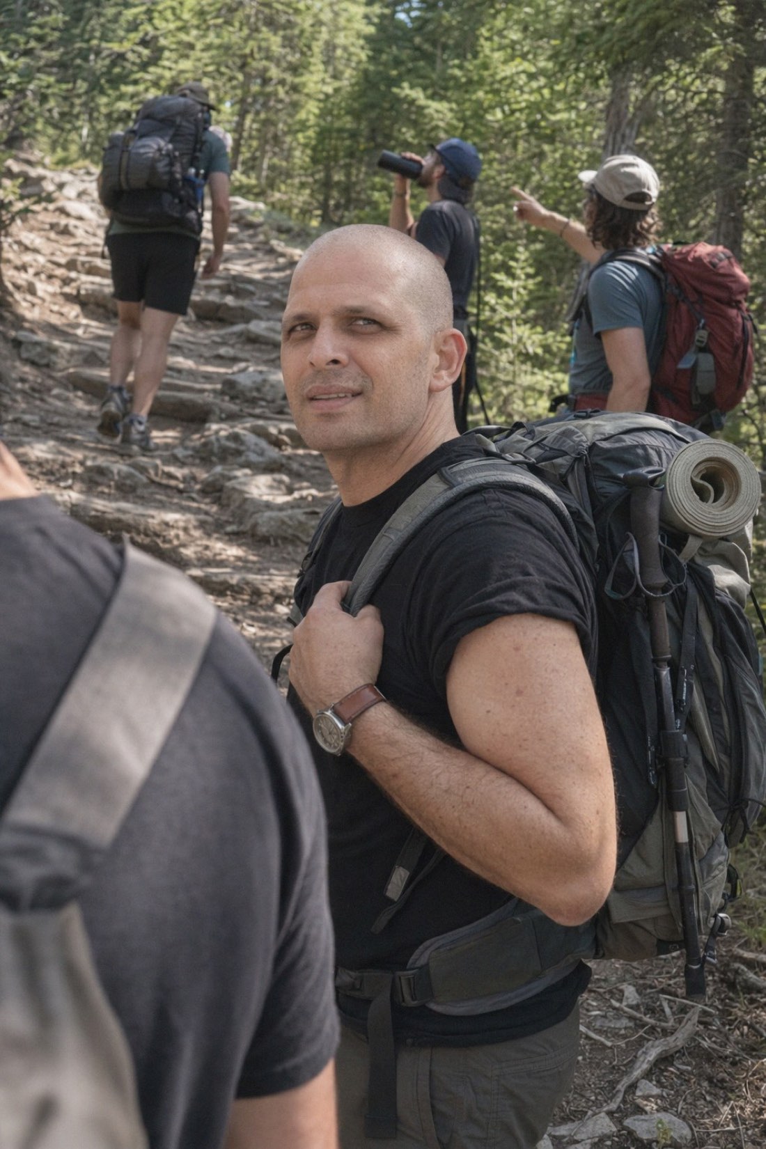 Man hiking a forest trail with a backpack, a realistic AI travel photo