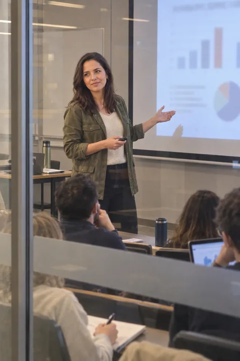 AI LinkedIn photo example: presenting in a seminar room, seen through the glass