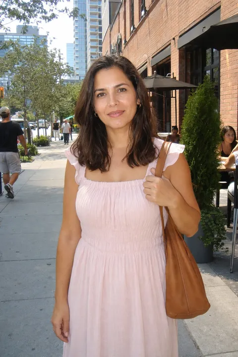 AI profile picture example: on a city street in a pink dress